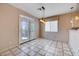 Dining area with tile floors, chandelier, and access to a patio at 752 Golden Sedum Dr, Henderson, NV 89011