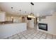 Open kitchen with island, white cabinets, and a view of the dining area at 752 Golden Sedum Dr, Henderson, NV 89011