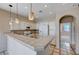 Kitchen with white cabinets, tile flooring and breakfast bar at 752 Golden Sedum Dr, Henderson, NV 89011