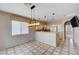 Kitchen with light cabinets, tile counters, and a breakfast bar at 752 Golden Sedum Dr, Henderson, NV 89011