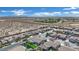 Expansive aerial view of a neighborhood with desert landscape and mountain backdrop under a partly cloudy sky at 7912 Rushmore Ave, Las Vegas, NV 89131