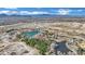 Wide aerial shot featuring ponds and desert landscaping, set against a mountain backdrop and blue sky at 7912 Rushmore Ave, Las Vegas, NV 89131