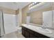 Bathroom with double sinks, modern fixtures, and shower over tub at 7912 Rushmore Ave, Las Vegas, NV 89131