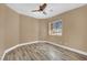 Cozy bedroom with decorative window and ceiling fan at 7912 Rushmore Ave, Las Vegas, NV 89131