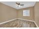 Bright, empty bedroom with ceiling fan and window at 7912 Rushmore Ave, Las Vegas, NV 89131