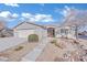 Charming single-story home showcasing desert landscaping, arched entryway, and a two-car garage at 7912 Rushmore Ave, Las Vegas, NV 89131