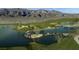 Lush golf course with water features, sand traps, and mountain views, offering a serene and challenging experience at 7912 Rushmore Ave, Las Vegas, NV 89131