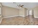 Spacious main bedroom featuring a ceiling fan, ensuite bathroom, and hardwood floors at 7912 Rushmore Ave, Las Vegas, NV 89131