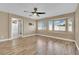 Large main bedroom with three bright windows, ceiling fan, and ensuite bathroom with shower at 7912 Rushmore Ave, Las Vegas, NV 89131