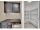 Office space with built-in desk and shelving, plus additional pantry storage at 7912 Rushmore Ave, Las Vegas, NV 89131