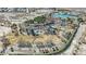 An aerial shot of the park shows trees surrounding ponds with shelters. It also has paved trails for walking at 7912 Rushmore Ave, Las Vegas, NV 89131