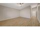 Bright bedroom featuring tile flooring, ceiling fan, and an open doorway leading to the bathroom at 7992 Barntucket Ave, Las Vegas, NV 89147