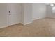 Tiled entryway with a neutral color palette and a view of a room with natural light at 7992 Barntucket Ave, Las Vegas, NV 89147