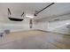 Spacious garage with ample storage space with painted walls, epoxy floors and overhead storage at 7992 Barntucket Ave, Las Vegas, NV 89147