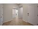 Hallway with tiled flooring, leading to the laundry room and garage entrance at 7992 Barntucket Ave, Las Vegas, NV 89147