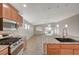 Spacious kitchen featuring stainless steel appliances and a large granite countertop island at 7992 Barntucket Ave, Las Vegas, NV 89147