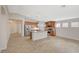 Open kitchen featuring stainless steel appliances, granite countertops, and a large island with pendant lighting at 7992 Barntucket Ave, Las Vegas, NV 89147