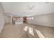 Bright living room with tile flooring, and an open view of the kitchen at 7992 Barntucket Ave, Las Vegas, NV 89147