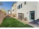 Private backyard with artificial turf and storage shed at 8125 Monsoon Bay St, Las Vegas, NV 89113