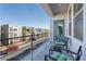 Private balcony showcasing community views and seating at 8125 Monsoon Bay St, Las Vegas, NV 89113