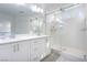 Modern bathroom with double vanity, large mirror, and shower at 8125 Monsoon Bay St, Las Vegas, NV 89113