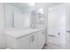 Modern bathroom with white vanity, quartz countertop, and gray floor tiles at 8125 Monsoon Bay St, Las Vegas, NV 89113