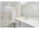 Clean bathroom boasts a shower/tub combo and white vanity at 8125 Monsoon Bay St, Las Vegas, NV 89113