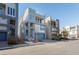 Row of modern townhouses with rooftop decks and attached garages at 8125 Monsoon Bay St, Las Vegas, NV 89113