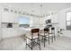 Bright kitchen featuring white shaker cabinets and island at 8125 Monsoon Bay St, Las Vegas, NV 89113