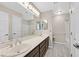 Bathroom features double sinks and a shower and bath combo at 8201 Lake Isle Ct, Las Vegas, NV 89145