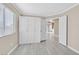 Bedroom with wood-look floors, large closet, and neutral colors at 8201 Lake Isle Ct, Las Vegas, NV 89145