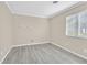 Bedroom featuring wood-look flooring and lots of natural light at 8201 Lake Isle Ct, Las Vegas, NV 89145