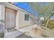 Inviting front entrance with a secure gate and a well-maintained walkway leading to the front door at 8201 Lake Isle Ct, Las Vegas, NV 89145