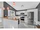 Modern kitchen with white cabinetry, stainless steel appliances, butcher block counters, and pendant lighting at 8201 Lake Isle Ct, Las Vegas, NV 89145