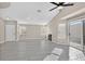 Bright and airy living room featuring tile floors, a fireplace, and sliding glass doors to the backyard at 8201 Lake Isle Ct, Las Vegas, NV 89145