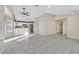 Open-concept living space seamlessly connects the living room and kitchen with modern tile flooring at 8201 Lake Isle Ct, Las Vegas, NV 89145