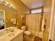 Cozy bathroom featuring a shower with curtain, vanity, and neutral wall coloring at 8203 Heather Rock Ct, Las Vegas, NV 89117