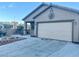 Charming home with a two car garage and a stone planter in the front yard at 8203 Heather Rock Ct, Las Vegas, NV 89117