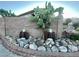 Unique front yard landscaping featuring rock garden, eagles, and a healthy cactus at 8203 Heather Rock Ct, Las Vegas, NV 89117