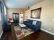 Bright living room with modern sofa, decorative rug, and ample natural light at 8203 Heather Rock Ct, Las Vegas, NV 89117