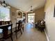 Open-concept living and dining area with neutral walls and tile flooring at 8203 Heather Rock Ct, Las Vegas, NV 89117