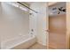 Bright bathroom featuring a tiled tub with shower and window at 85 Alerion St, Las Vegas, NV 89138