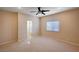 Spacious bedroom with carpet, ceiling fan, and a window providing natural light at 85 Alerion St, Las Vegas, NV 89138