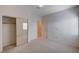 Spacious carpeted bedroom with a mirrored closet, neutral walls and natural light at 85 Alerion St, Las Vegas, NV 89138