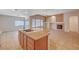 Spacious kitchen with cooktop island blending into the open concept living spaces at 85 Alerion St, Las Vegas, NV 89138