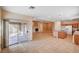 Open-concept kitchen featuring granite countertops, a center island cooktop, and tile flooring at 85 Alerion St, Las Vegas, NV 89138