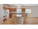 Spacious kitchen featuring a center island cooktop, granite counters, and modern appliances at 85 Alerion St, Las Vegas, NV 89138