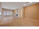 Bright living room with tile floors, large windows, and a cozy fireplace at 85 Alerion St, Las Vegas, NV 89138