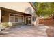 Covered patio area with sliding glass doors and landscaping in the backyard at 85 Alerion St, Las Vegas, NV 89138