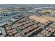 Areal view of the community with houses, businesses, and distant mountains at 8523 Peaceful Dreams St, Las Vegas, NV 89139